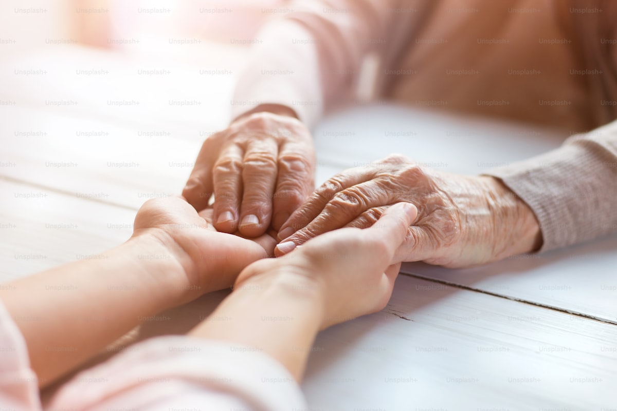 Grandmother and granddaughter holding hands